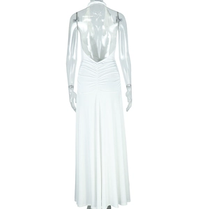 Detail view of the backless halter dress showing ruched fabric and slim fit design