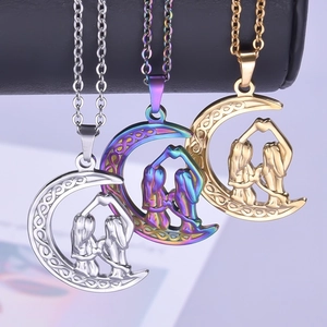 Three celestial moon necklaces in silver, gold, and rainbow finishes for women