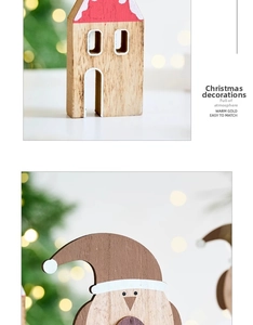 Detail of wooden Christmas house and character decor with festive warm bokeh lights