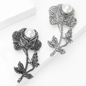 Vintage rose brooches with gunmetal and antique silver finish featuring pearls and crystals