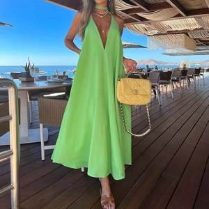 Neon green halter V-neck maxi dress with an open back, perfect for beach vacations
