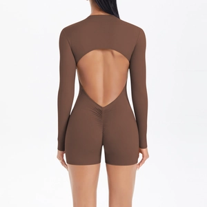 Macro detail of U-shaped back cutout and scrunch butt seam on brown yoga bodysuit