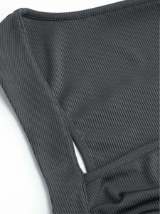 Detailed close-up of dark gray ribbed knit fabric with high-density vertical texture