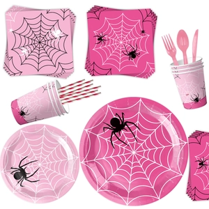 Pink and black spider web themed disposable party tableware set on a plain white background