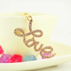 Sparkling rhinestone LOVE letter keychain accessory with gold finish and crystal stones