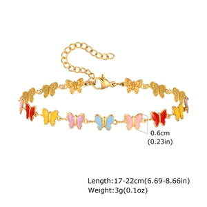 Detail of gold bracelet showing 0.6cm colorful enamel butterflies and adjustable lobster clasp