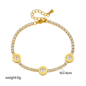 Elegant gold titanium bracelet featuring Roman numeral discs and sparkling rhinestones