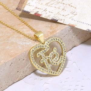Gold plated heart pendant necklace with FE lettering and white cubic zirconia stones