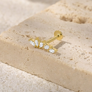 Detailed macro view of S925 sterling silver gold earring with marquise cut gemstones