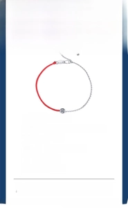 Detailed macro view of s925 silver moissanite bracelet with a red woven lucky rope design