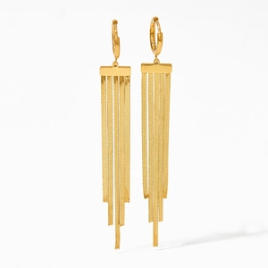 Detailed view of long gold-plated snake chain tassels on stainless steel earrings