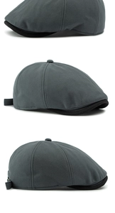 Detail view of dark grey herringbone newsboy cap with black brim and wool blend texture