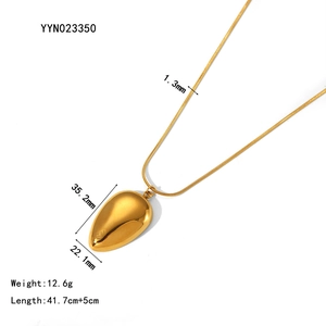 Detail view of gold teardrop pendant necklace with dimensions 35.2x22.1mm and chain specs