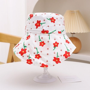 Detail of kids sun hat with floral print and adjustable white chin strap buckle