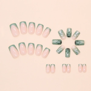 Bamboo green and nude pink press-on nails set with silver glitter and floral patterns