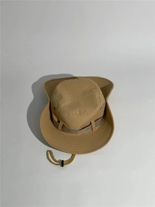 Detail showing reinforced stitching on the brim and adjustable chin strap of the khaki sun hat