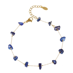 Detail of gold chain bracelet with deep blue polished gravel stones and lobster clasp