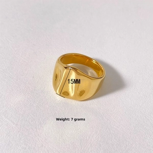 Detail view of 15mm wide wavy gold ring with textured surface and 7g weight spec