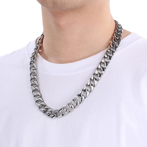 15mm silver stainless steel Cuban link necklace for men worn on a white t-shirt