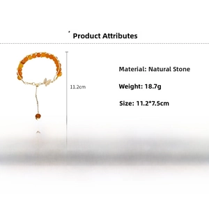 Detail view of retro beaded bracelet with orange stones, butterfly charm, and size specs