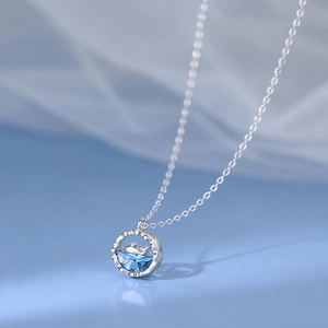 S925 sterling silver whale necklace featuring a blue gemstone and hollow ocean pendant