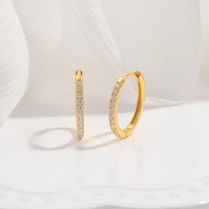 Close-up of S925 sterling silver stamp on gold plated zircon small hoop earrings