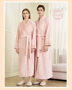 Detail of light pink flannel bathrobe showing waffle texture on collar and cuffs
