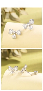Detail of bow-shaped pearl earring with screw back closure and clear heart zircon
