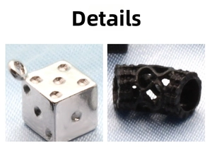 Detail view of silver dice pendant and black hollow dragon pattern charm bead for DIY
