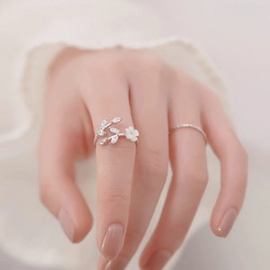 S925 sterling silver open ring featuring white flower and sparkling zircon leaf design