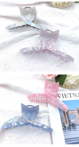 Pearlescent mermaid tail hair claws in silver, purple, pink, and blue acrylic finishes