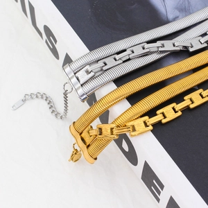 Layered gold and silver stainless steel chain bracelets with snake and geometric links