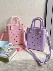 Pink and purple EVA beach bags with circular perforations and adjustable shoulder straps