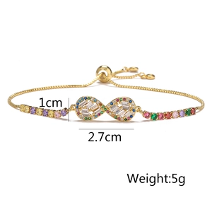 Macro shot of 18K gold infinity symbol bracelet with colorful zircon and stones