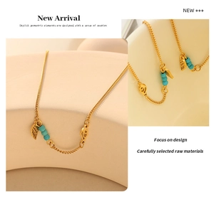 Close-up of gold titanium steel anklet featuring turquoise beads and wing charm details