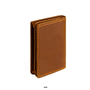 Side view of vintage crazy horse leather card holder with rugged yellow stitching detail