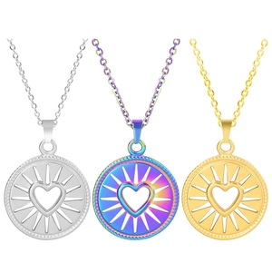 Detailed view of three stainless steel necklaces with hollow heart pendants in gold and silver