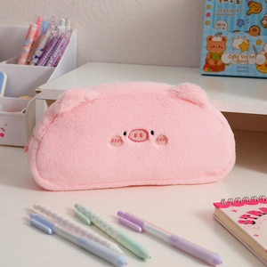 Close-up of soft plush pig pencil case featuring detailed embroidery and 3D ears
