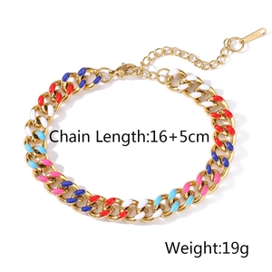 Macro detail of colorful enamel stainless steel Cuban link bracelet with lobster clasp
