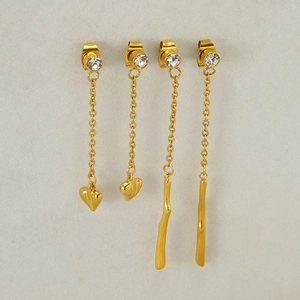 Golden heart and linear tassel earrings with sparkling crystals in a minimalist style