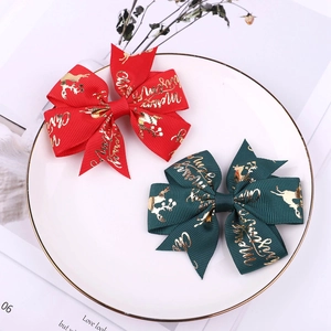Red and green Christmas bow hair clips with gold elk print and Merry Christmas text