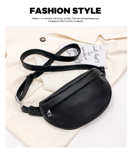 Chic black PU leather crescent waist bag with wide strap on a stylish blazer background