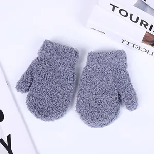 Warm coral fleece children's mittens in grey with ribbed cuffs on white background