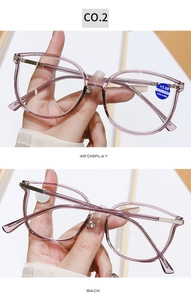 Detail view of pink transparent anti-blue light reading glasses with silver metal hinges