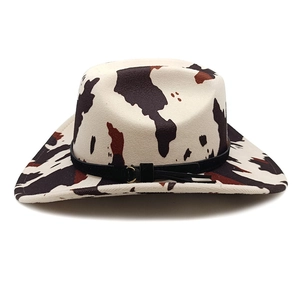 Vintage cow print western cowboy hat with wide brim and decorative metal buckle band
