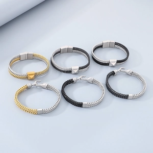 Detail view of woven leather bracelets with metallic magnetic clasps in gold, silver, and black