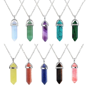Macro display of ten hexagonal crystal pendants in various vibrant colors and silver chains
