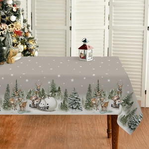 Waterproof Christmas tablecloth with snowman and reindeer print on a festive wooden table