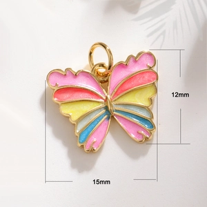 Detail of colorful enamel butterfly pendants in gold frames with 15mm by 12mm dimensions