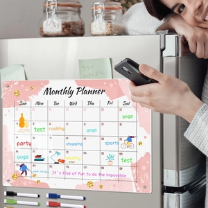 Magnetic weekly planner on fridge with 8 colorful markers and pink watercolor design